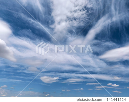 Dramatic Cloud Layers Above Blue Summer Landscape Dramatic Cloud Layers Above Blue Summer Landscape 141441224