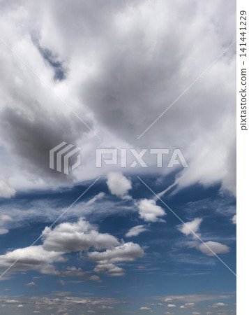 Towering Cloud Formation Above Blue Summer Horizon Towering Cloud Formation Above Blue Summer Horizon 141441229