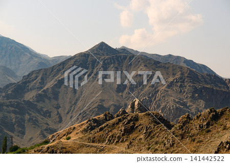 Dramatic desert mountain landscape with clear skies Dramatic desert mountain landscape with clear skies 141442522