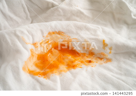 Dirty sauce stain on cloth to wash with washing powder, cleaning housework. Dirty sauce stain on cloth to wash with washing powder, cleaning housework. 141443295