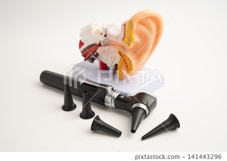 Otoscope with model for audiologist or ENT doctor use otoscope checking ear and treat hearing loss problem. Otoscope with model for audiologist or ENT doctor use otoscope checking ear and treat hearing loss problem. 141443296
