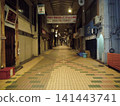 A deserted shopping arcade at night 141443741