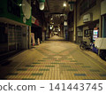 A deserted shopping arcade at night 141443745