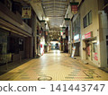 A deserted shopping arcade at night 141443747