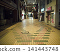 A deserted shopping arcade at night 141443748