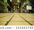 A deserted shopping arcade at night 141443749