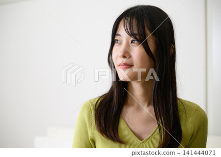 A Japanese woman gazing out the window A Japanese woman gazing out the window 141444071