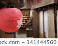 Red lanterns hanging from a Japanese-style building 141444560