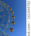 A Ferris wheel and copy space against a blue sky 141444782