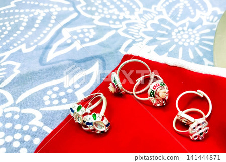 Traditional Silver Toe Rings (Bichhiya) on Red Velvet Display Traditional Silver Toe Rings (Bichhiya) on Red Velvet Display 141444871