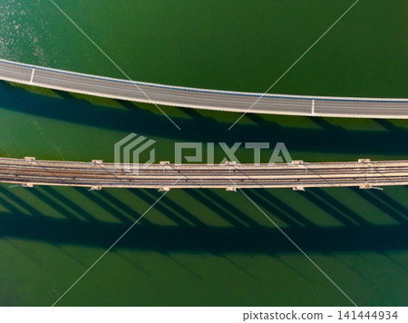 Bridges connect land to land over water during daylight Bridges connect land to land over water during daylight 141444934