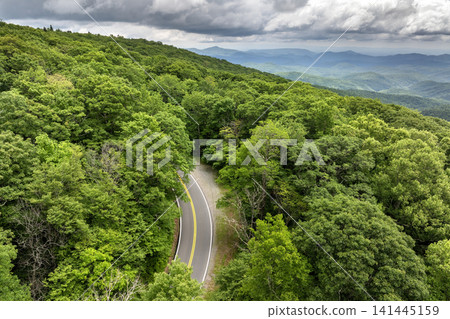 Forest road in North Carolina Appalachian mountains, USA. Blue Ridge Parkway American highway in summer rain season 141445159