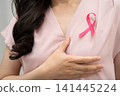 Asian woman with pink ribbon, World Breast Cancer Day at October. 141445224