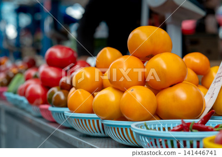 Multicolored tomatoes on a market stall. Farmers market. Multicolored tomatoes on a market stall. Farmers market. 141446741