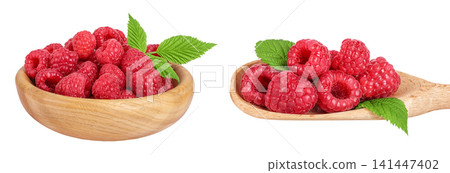 Ripe raspberries in wooden bowl and spoon isolated on a white background 141447402