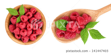 Ripe raspberries in wooden bowl and spoon isolated on a white background. Top view. Flat lay Ripe raspberries in wooden bowl and spoon isolated on a white background. Top view. Flat lay 141447403