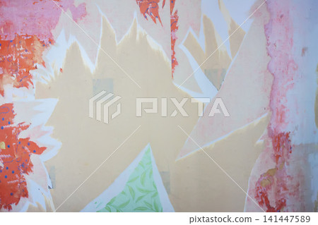 Interior renovation process revealing old wallpaper layers and unfinished plaster beneath. Interior renovation process revealing old wallpaper layers and unfinished plaster beneath. 141447589