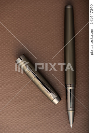 Fountain pen, beautiful fountain pen with detailed design on a brown synthetic leather surface, selective focus. Fountain pen, beautiful fountain pen with detailed design on a brown synthetic leather surface, selective focus. 141447840