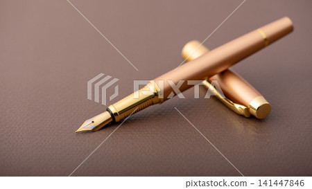 Fountain pen, beautiful fountain pen with detailed design on a brown synthetic leather surface, selective focus. 141447846