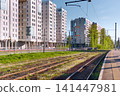 railway station next to the residential complex in Saint-Petersburg - Russia at clear sunny weather, railway tracks, rails and sleepers 141447981
