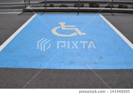 Wheelchair mark caring parking lot 141448095