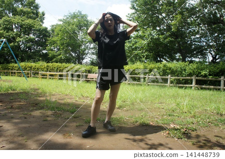 Girl posing in the park Girl posing in the park 141448739