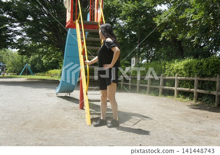 Girl posing in the park Girl posing in the park 141448743