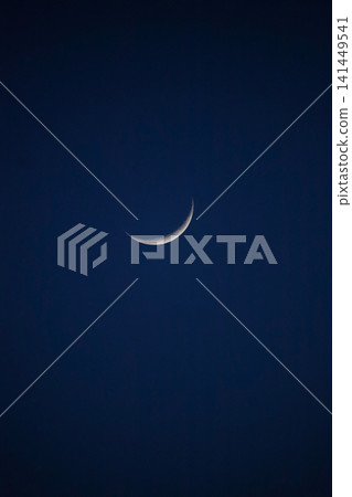 A crescent moon floating in the sky A crescent moon floating in the sky 141449541