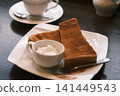 Cinnamon toast eaten at a coffee shop 141449543