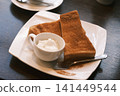 Cinnamon toast eaten at a coffee shop 141449544