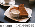 Cinnamon toast eaten at a coffee shop 141449545