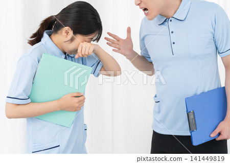 Male staff member gets angry at female staff member 141449819