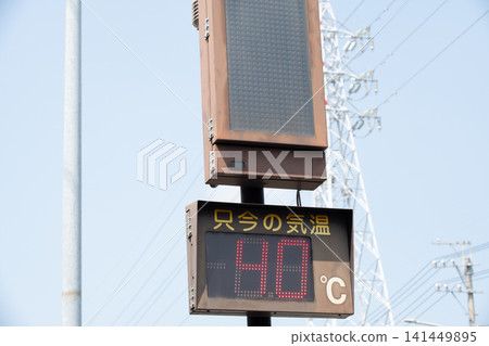An electronic sign along the road showing the current temperature of 40°C An electronic sign along the road showing the current temperature of 40°C 141449895