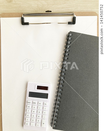 Clipboard and calculator, black notebook - household finance management, accounting, budgeting, bookkeeping, tax returns, estimates, billing, money Clipboard and calculator, black notebook - household finance management, accounting, budgeting, bookkeeping, tax returns, estimates, billing, money 141450752