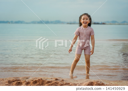 happy preschool child girl playing on sea beach in Pattaya, Thailand happy preschool child girl playing on sea beach in Pattaya, Thailand 141450929