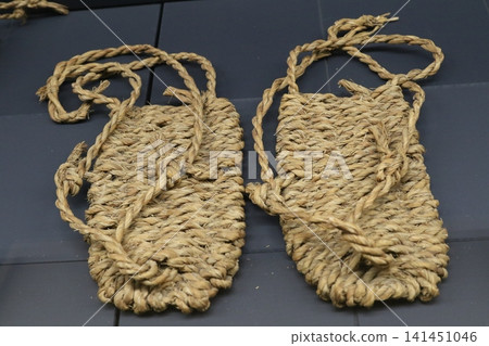 Traditional straw sandals (waraji): Cultural artifacts of Japanese straw footwear. Traditional straw sandals (waraji): Cultural artifacts of Japanese straw footwear. 141451046