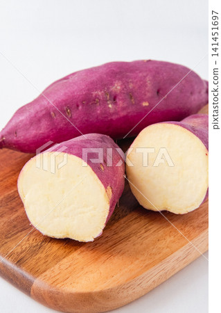 Cross-section of a sweet potato harvested in autumn Cross-section of a sweet potato harvested in autumn 141451697