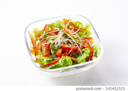 Red bell pepper and tomato salad on a white background 141452323