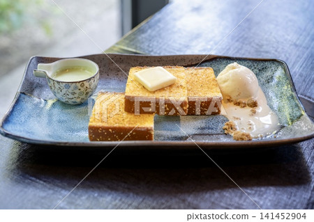 A luxurious, buttery, toasted castella cake A luxurious, buttery, toasted castella cake 141452904