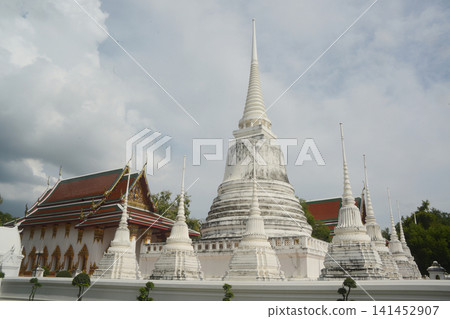 The white pagoda and the ordination hall of Wat Suwan Dara Ram Ratchaworawihanan ancient templeare distinguished by their magnificent and highly valuable murals in Thailand. The white pagoda and the ordination hall of Wat Suwan Dara Ram Ratchaworawihanan ancient templeare distinguished by their magnificent and highly valuable murals in Thailand. 141452907