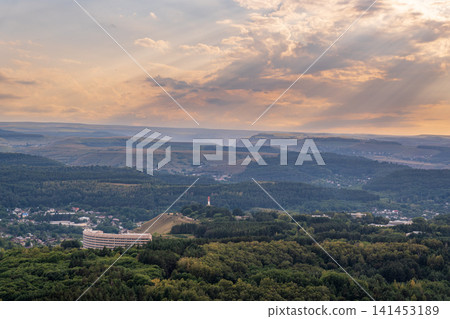 Layers of green mountains and hills in the haze during sunset. Panoramic View of Green hills and Meadow. Layers of green mountains and hills in the haze during sunset. Panoramic View of Green hills and Meadow. 141453189