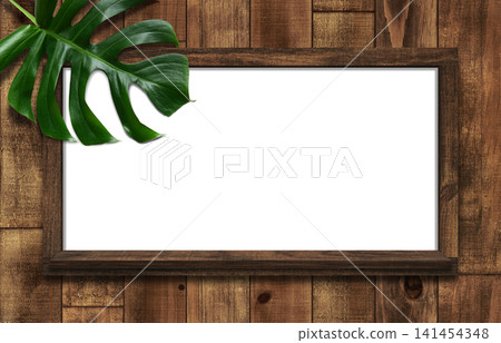 A dark oak whiteboard with shelves, adorned with monstera leaves. A dark oak whiteboard with shelves, adorned with monstera leaves. 141454348