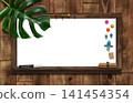 A dark oak whiteboard with shelves, adorned with monstera leaves. 141454354