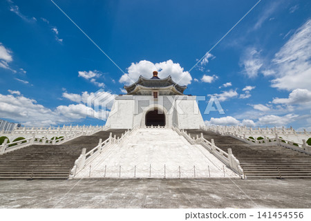 A stunning front view of the Chiang Kai-shek Memorial Hall in Taiwan, set against a backdrop of blue sky and clouds. A stunning front view of the Chiang Kai-shek Memorial Hall in Taiwan, set against a backdrop of blue sky and clouds. 141454556