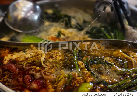 Hot spicy mala hotpot boiling in pot Hot spicy mala hotpot boiling in pot 141455272