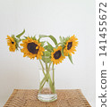 A bouquet of sunflowers in a vase 141455672