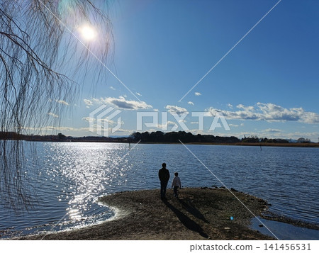Parents looking at the lake Parents looking at the lake 141456531