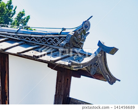 Decorative roof tiles on the udatsu (decorative roof finial) of the Hayashi family residence, a secondary inn in the former Ota-juku post town on the old Nakasendo road. Decorative roof tiles on the udatsu (decorative roof finial) of the Hayashi family residence, a secondary inn in the former Ota-juku post town on the old Nakasendo road. 141456689