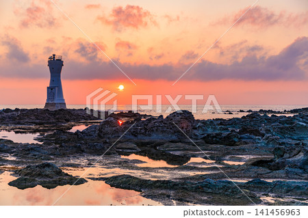 Sado Island's Nagate Cape Lighthouse and sunset in early summer, Sado City, Niigata Prefecture. Sado Island's Nagate Cape Lighthouse and sunset in early summer, Sado City, Niigata Prefecture. 141456963