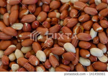Peanut harvest nestled in earthy hues showcasing the natural bounty of a farm during the golden hour of a late summer evening Peanut harvest nestled in earthy hues showcasing the natural bounty of a farm during the golden hour of a late summer evening 141456981